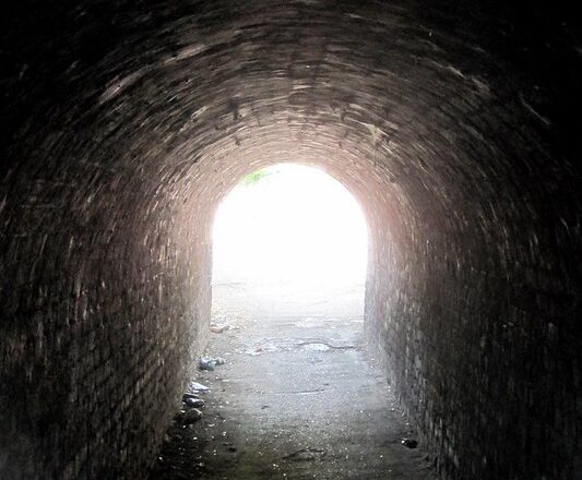 Near-Death Experience Tunnel Meaning: Folklore, Science, and Afterlife Belief